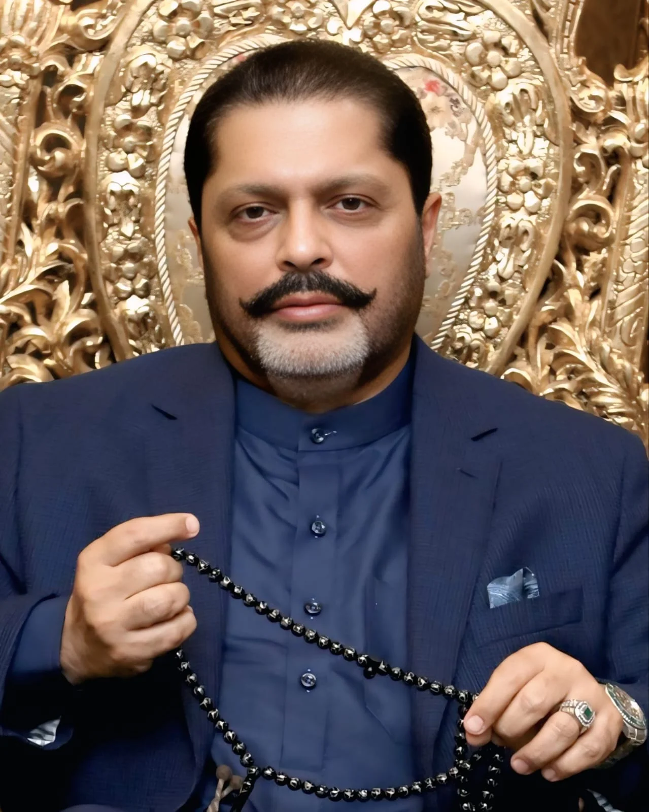 Portrait of Mehmood Trunkwala, Chairman of The World Group